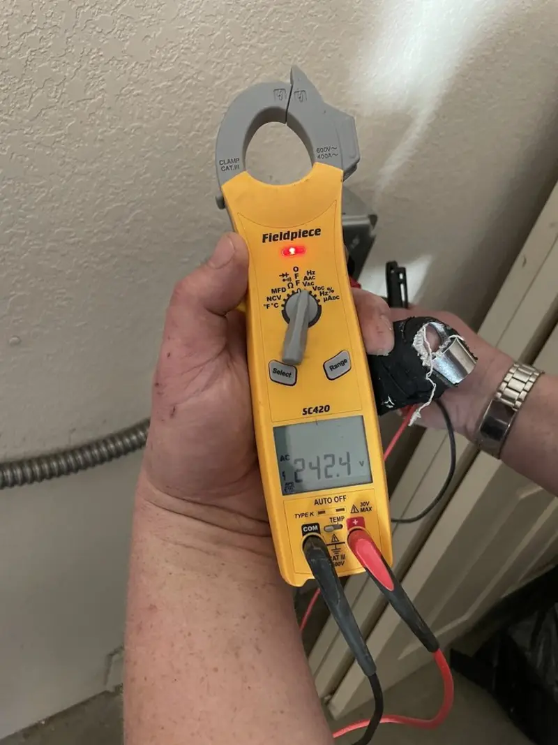 Voltage testing with clamp meter during Ceiling Fan Installation in Woodstown
